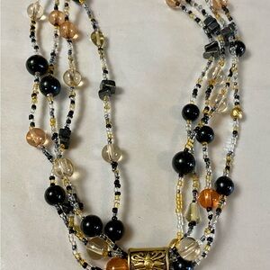 Black and Gold Multi-Strand Necklace with Artistic Design